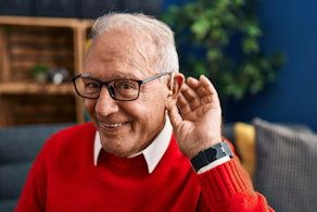 Life Assure Senior Woman Sitting In Chair And Laughing With Caregiver Nurse Blog